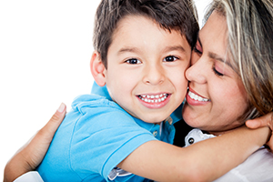 A person hugging a child